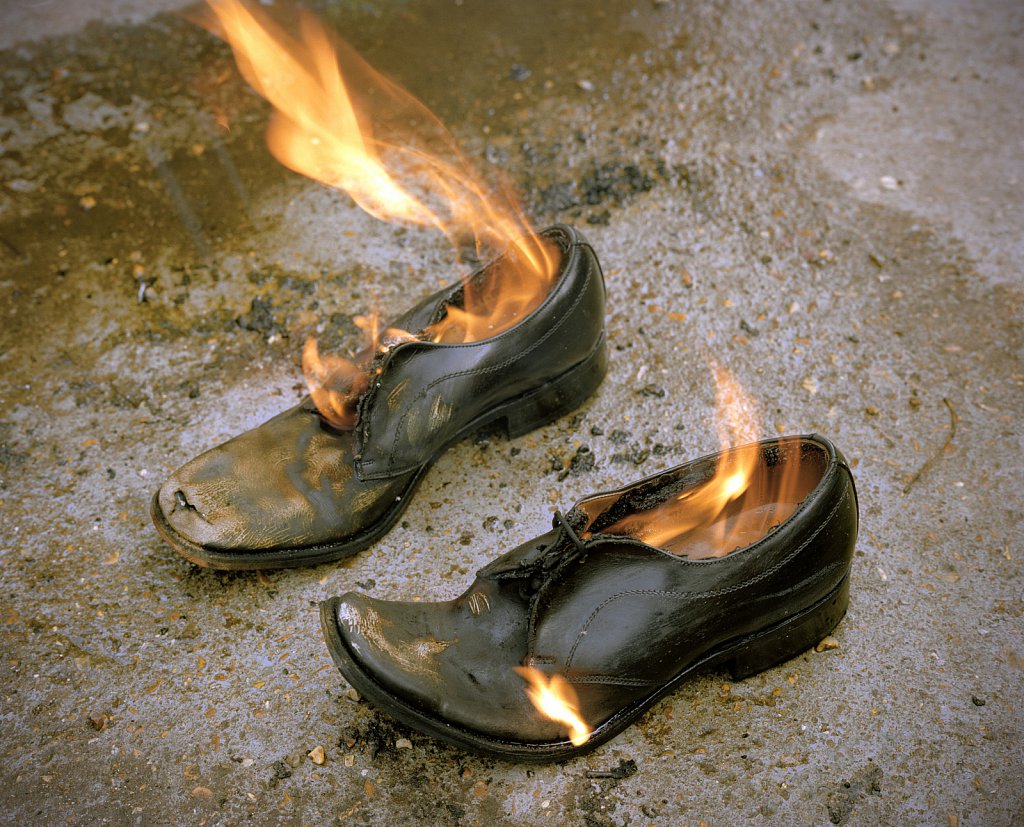 Shoes being burnt after a car boot sale, Bootle,Merseyside.